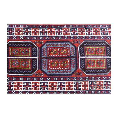 Field detail of Afghan Mashwani rug showing three medallions within red, navy and pale blue geometry