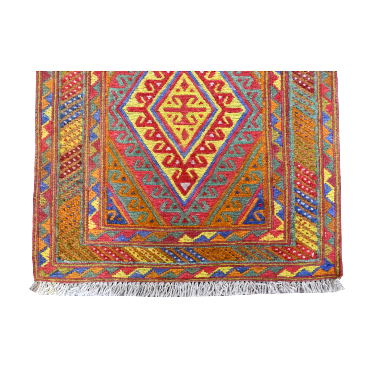 Fringe-end detail of Mashwani runner showing a concentric diamond medallion, colourful angular borders and light-grey fringe