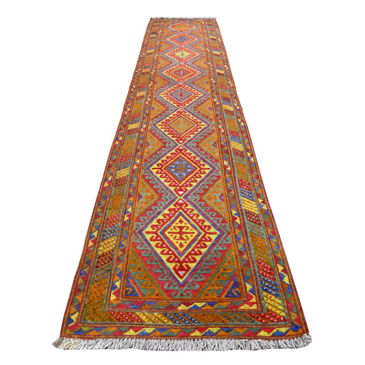 Full view of Afghan Mashwani handwoven wool runner with repeating diamond medallions and vivid multicoloured borders, 362 x 72 cm