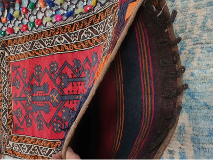 Corner detail of Afghan Pushti hand-knotted wool pillow cover showing woven texture