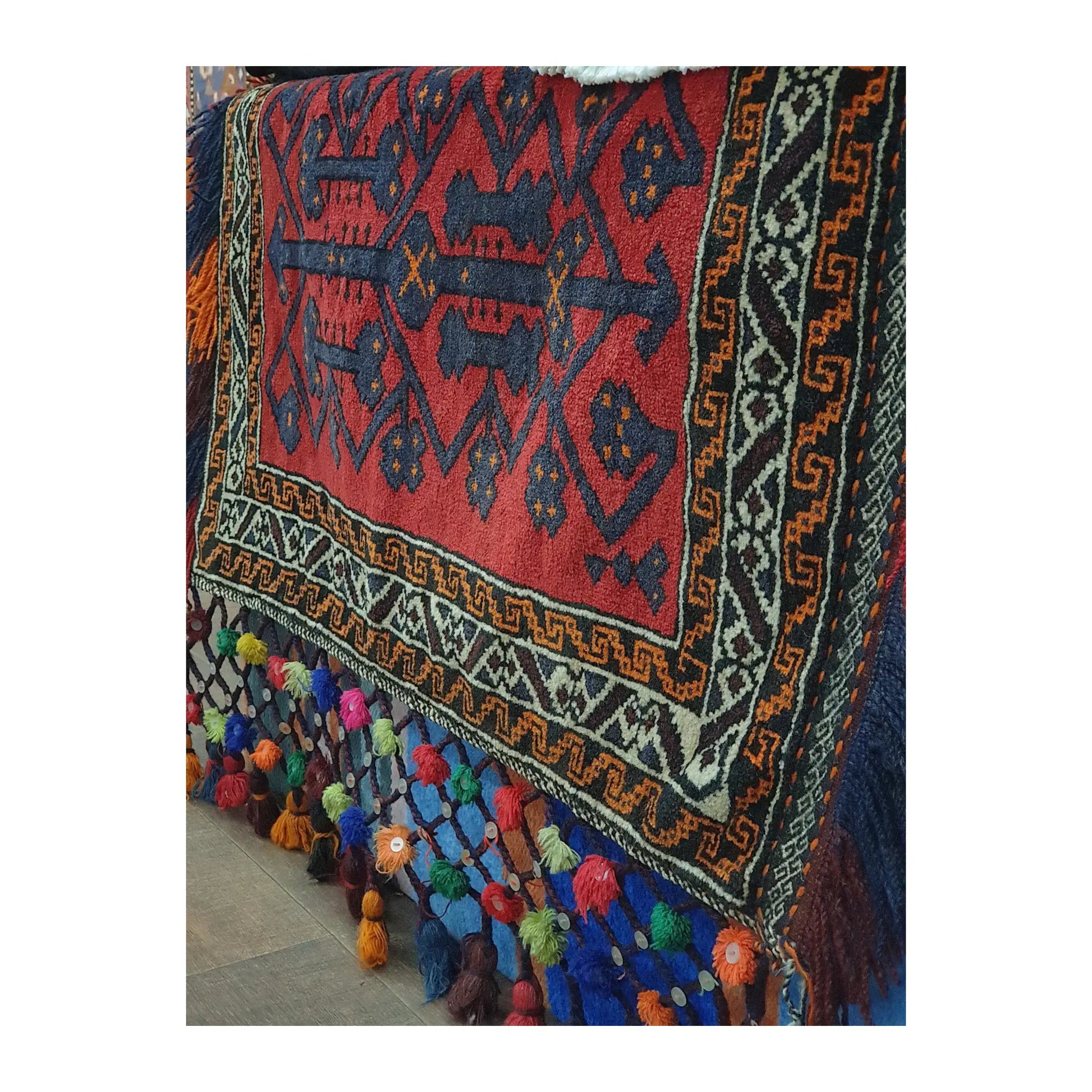 Side pattern detail of Afghan Pushti hand-knotted wool pillow cover with tribal design