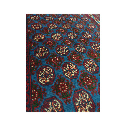 Angled field motif detail of Afghan Roshnai runner rug with blue wool pile and repeating burgundy medallions
