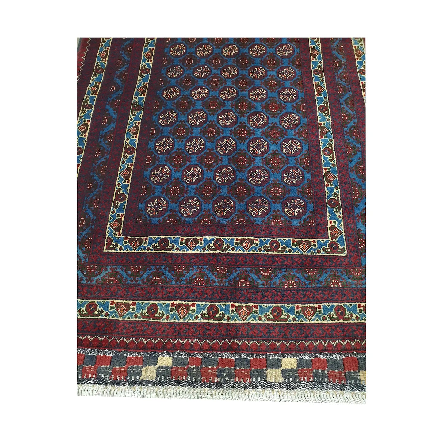 End field and fringe detail of Afghan Roshnai runner rug with blue medallion field and patterned burgundy border