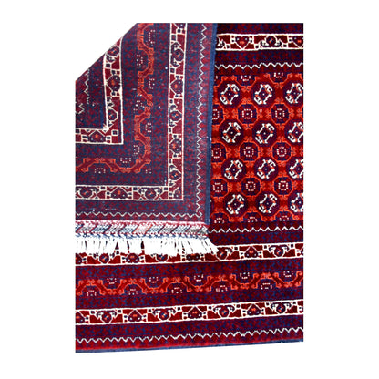 Folded-corner detail of Afghan Roshnai runner showing the reverse weave beside its red patterned front and white fringe