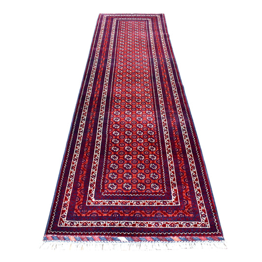 Full view of Afghan Roshnai hand-knotted wool runner with deep red field, small octagonal motifs and layered navy borders, 282 x 84 cm