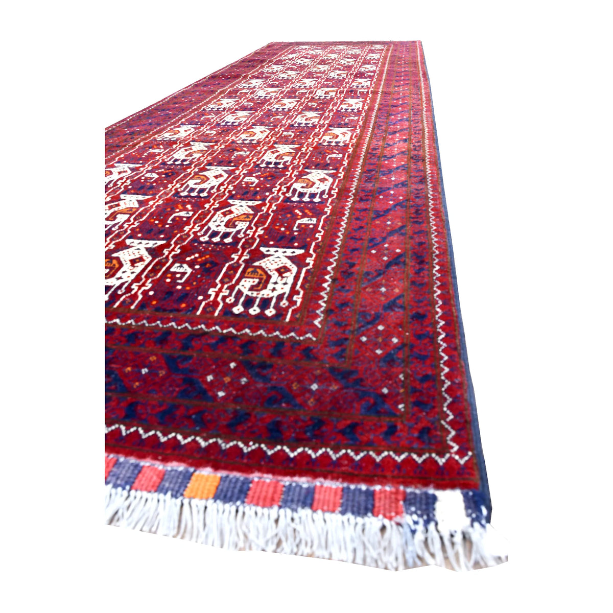 Angled view of Afghan Roshnai wool runner showing ivory motifs, navy and plum borders, striped end finish and white fringe