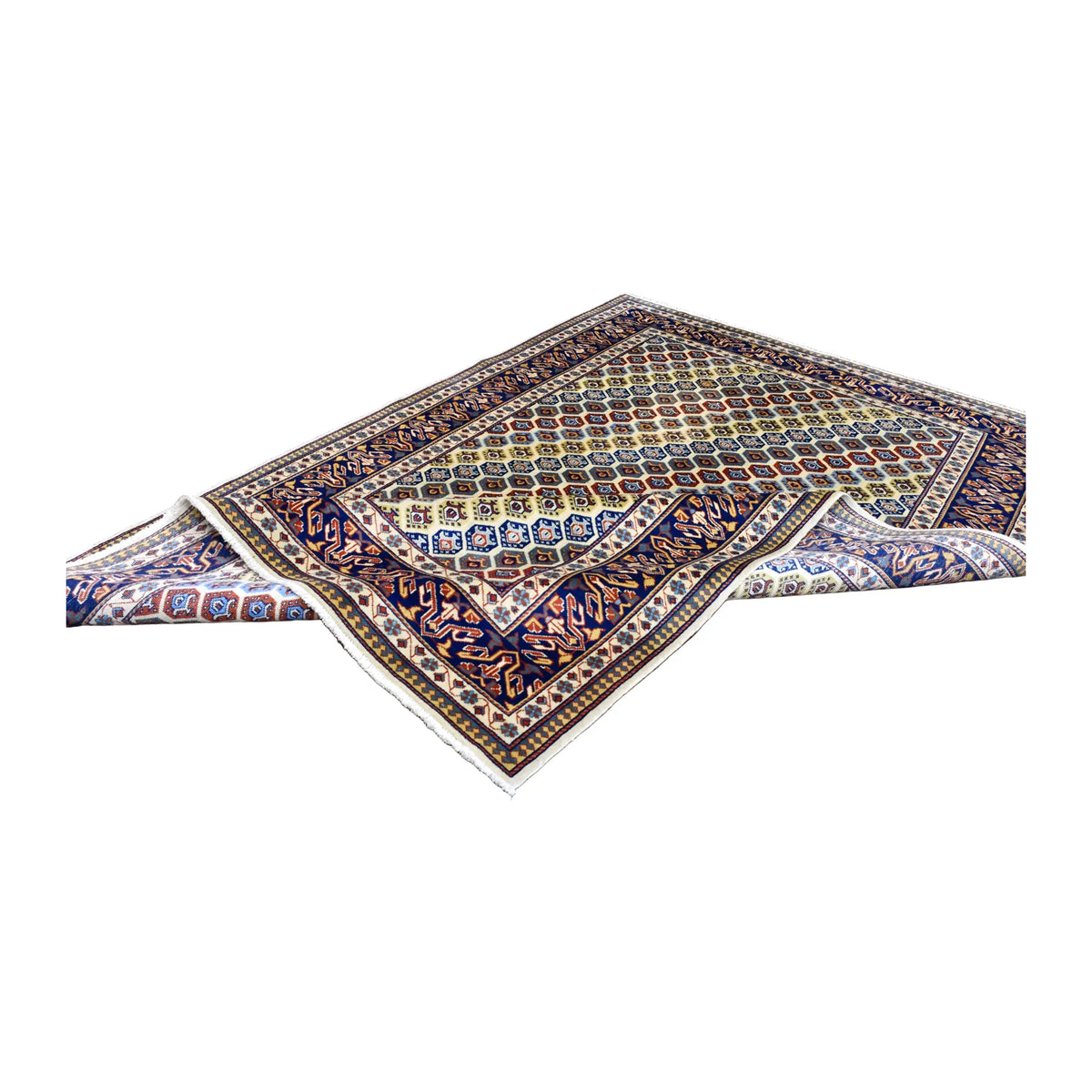 Folded view of Afghan Shirvan hand-knotted wool rug showing its intricate field, navy patterned border and fringe