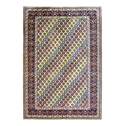 Full view of Afghan Shirvan hand-knotted wool rug with warm beige field, multicolour geometric lattice and deep navy border, 243 x 165 cm