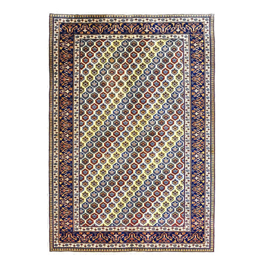 Full view of Afghan Shirvan hand-knotted wool rug with warm beige field, multicolour geometric lattice and deep navy border, 243 x 165 cm