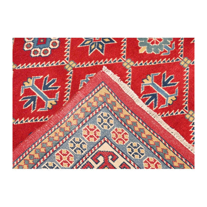 Folded corner detail of Afghan Shirvan wool rug showing patterned border and reverse weave, 221 x 159 cm