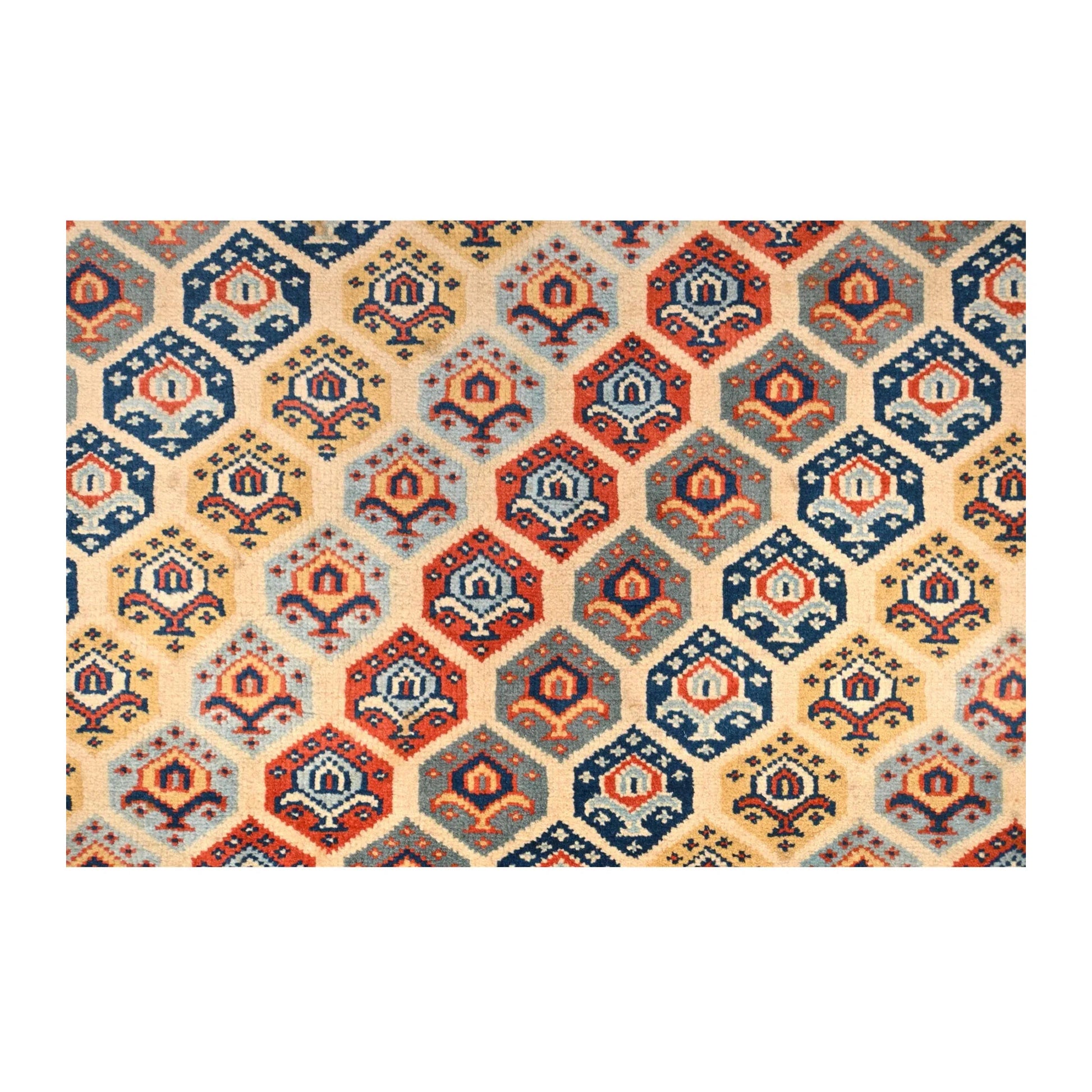Field detail of Afghan Shirvan wool rug showing repeating geometric motifs in beige, navy, rust red and teal, 243 x 165 cm