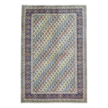Full view of Afghan Shirvan hand-knotted wool rug with beige field, geometric motifs and navy border, 243 x 165 cm