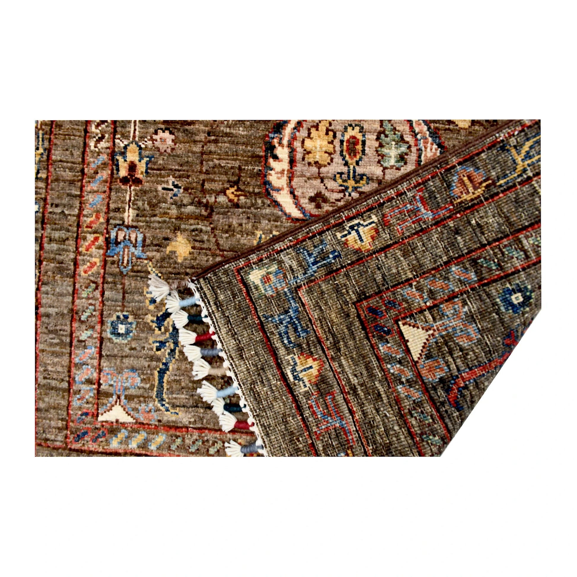 Folded corner reverse-weave detail of Afghan Sultani hand-knotted wool rug showing fringe, back structure and woven pattern