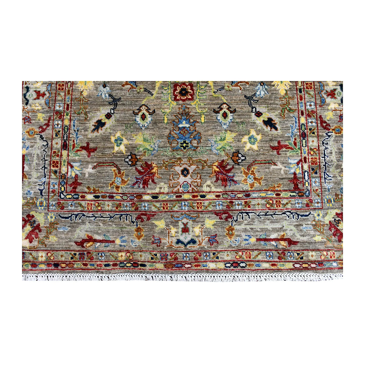 Fringe and end-border detail of Sultani rug with small pictorial and floral motifs in rust, blue, gold and green