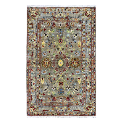 Full view of Afghan Sultani wool rug with grey-green field, central yellow-gold medallion and layered borders, 185 x 119 cm