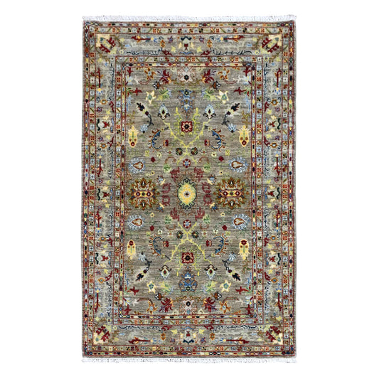 Full view of Afghan Sultani wool rug with grey-green field, central yellow-gold medallion and layered borders, 185 x 119 cm