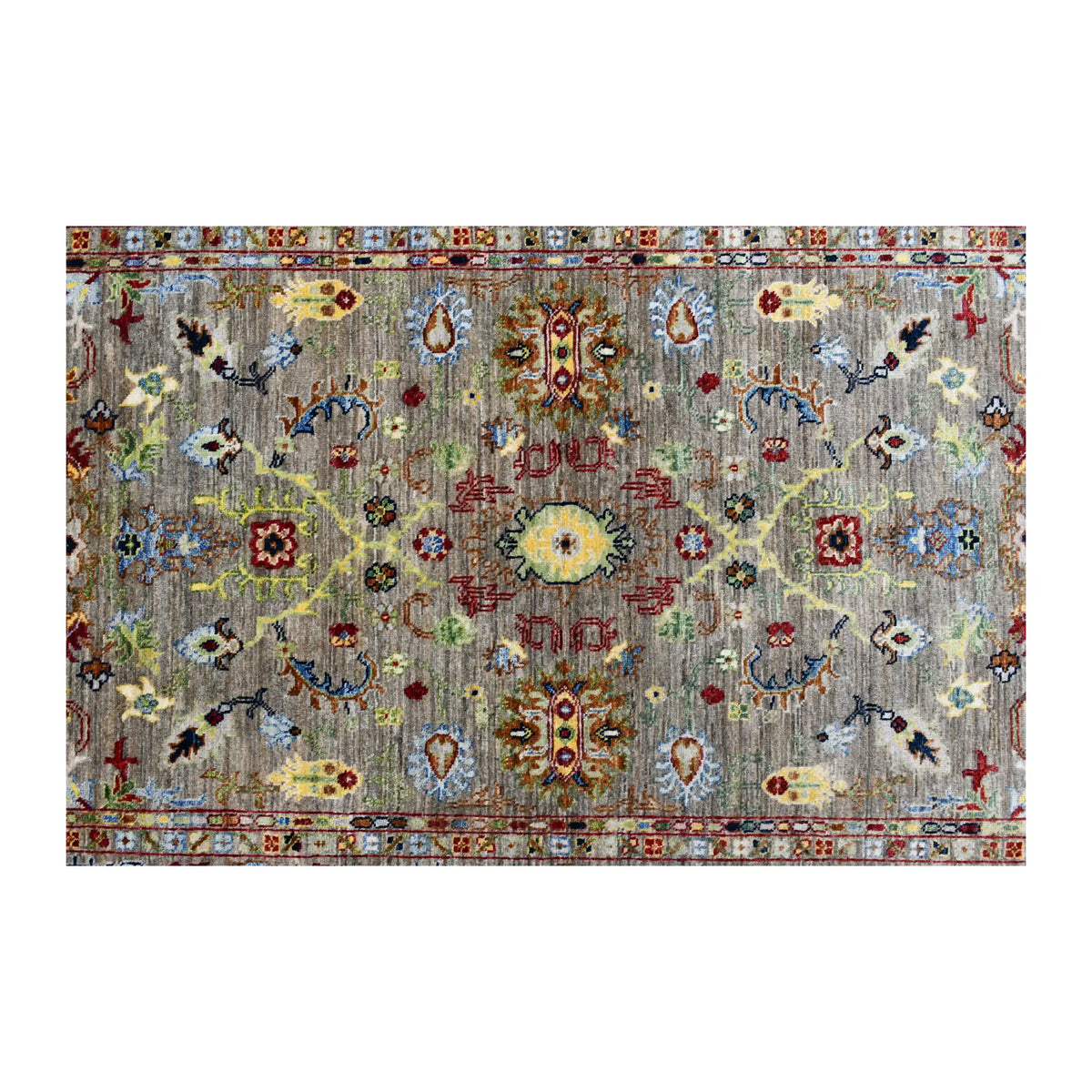 Field detail of Afghan Sultani rug showing mirror-balanced floral-geometric and pictorial motifs on grey-green