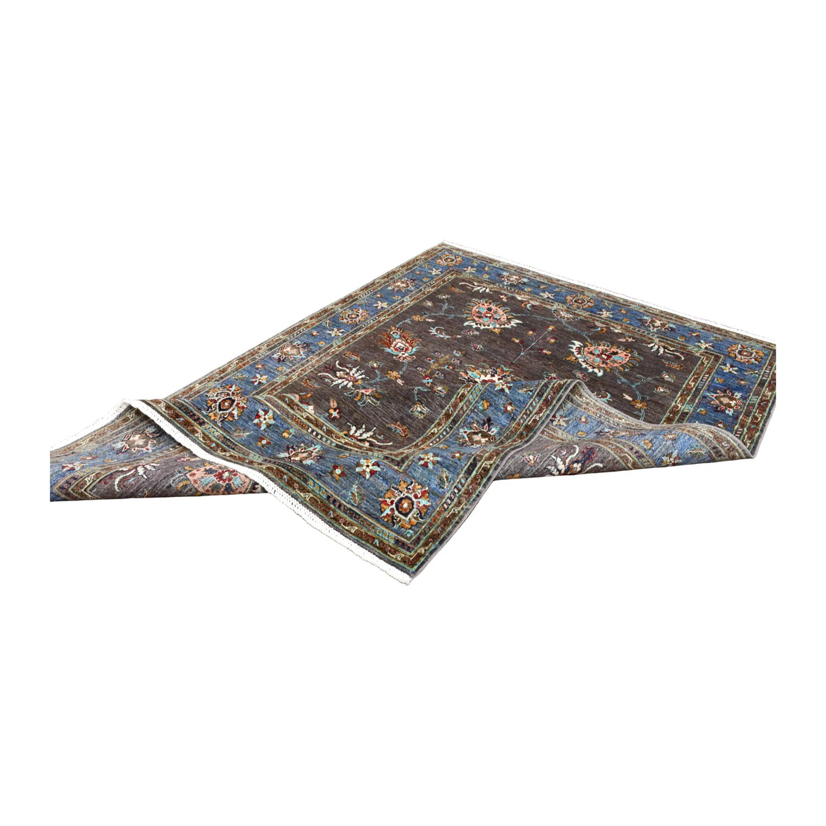 Folded view of Afghan Sultani hand-knotted wool rug showing its open floral field, broad blue border and white fringe