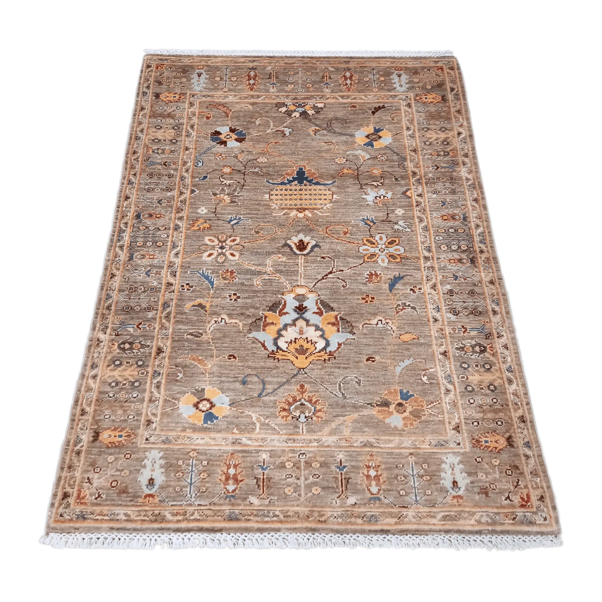 Angled view of Afghan Sultani wool rug with layered patterned borders, 157 x 101 cm