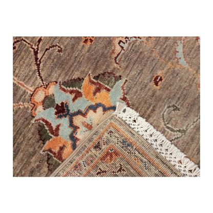 Folded-corner detail of Afghan Sultani wool rug showing fringe and reverse weave, 157 x 101 cm