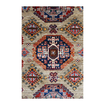 Central medallion detail of Super Kazak rug with deep navy stepped geometry, rust outline and ivory accents