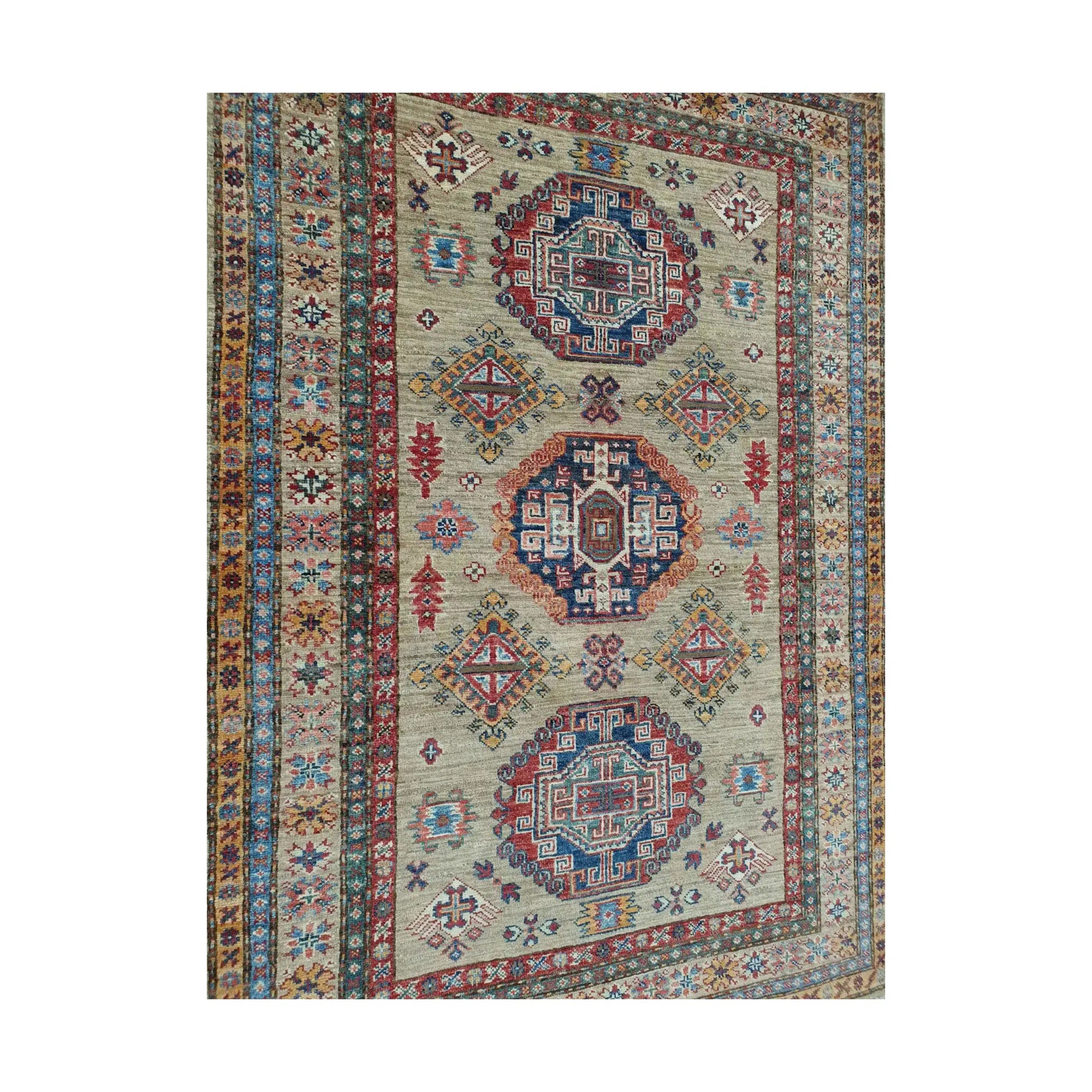 Close-up of Afghan Super Kazak wool rug showing geometric medallion motifs and hand-knotted detail