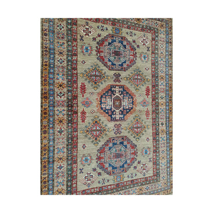 Close-up of Afghan Super Kazak wool rug showing geometric medallion motifs and hand-knotted detail