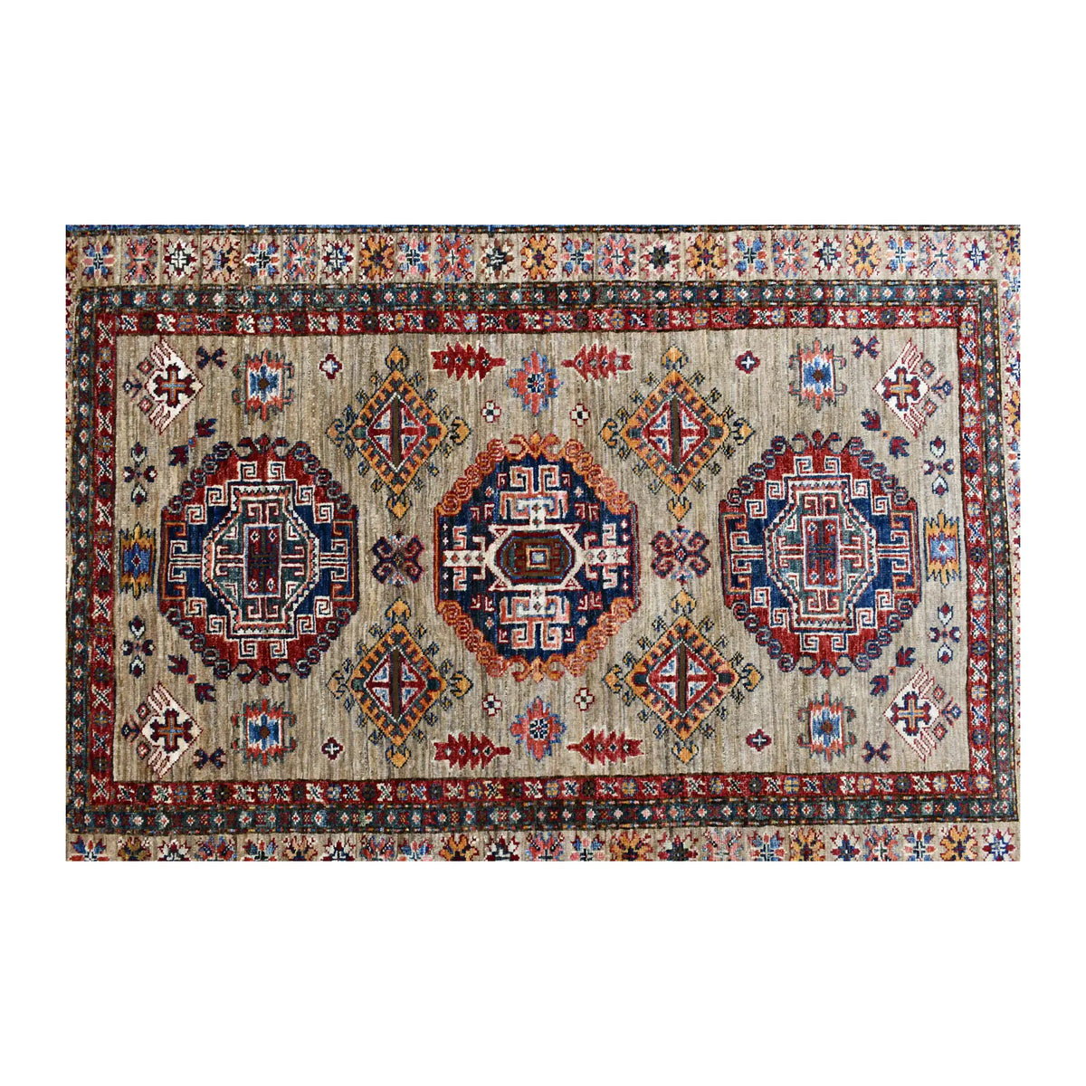 Field detail of Afghan Super Kazak rug showing three medallions and smaller diamond motifs on striated beige