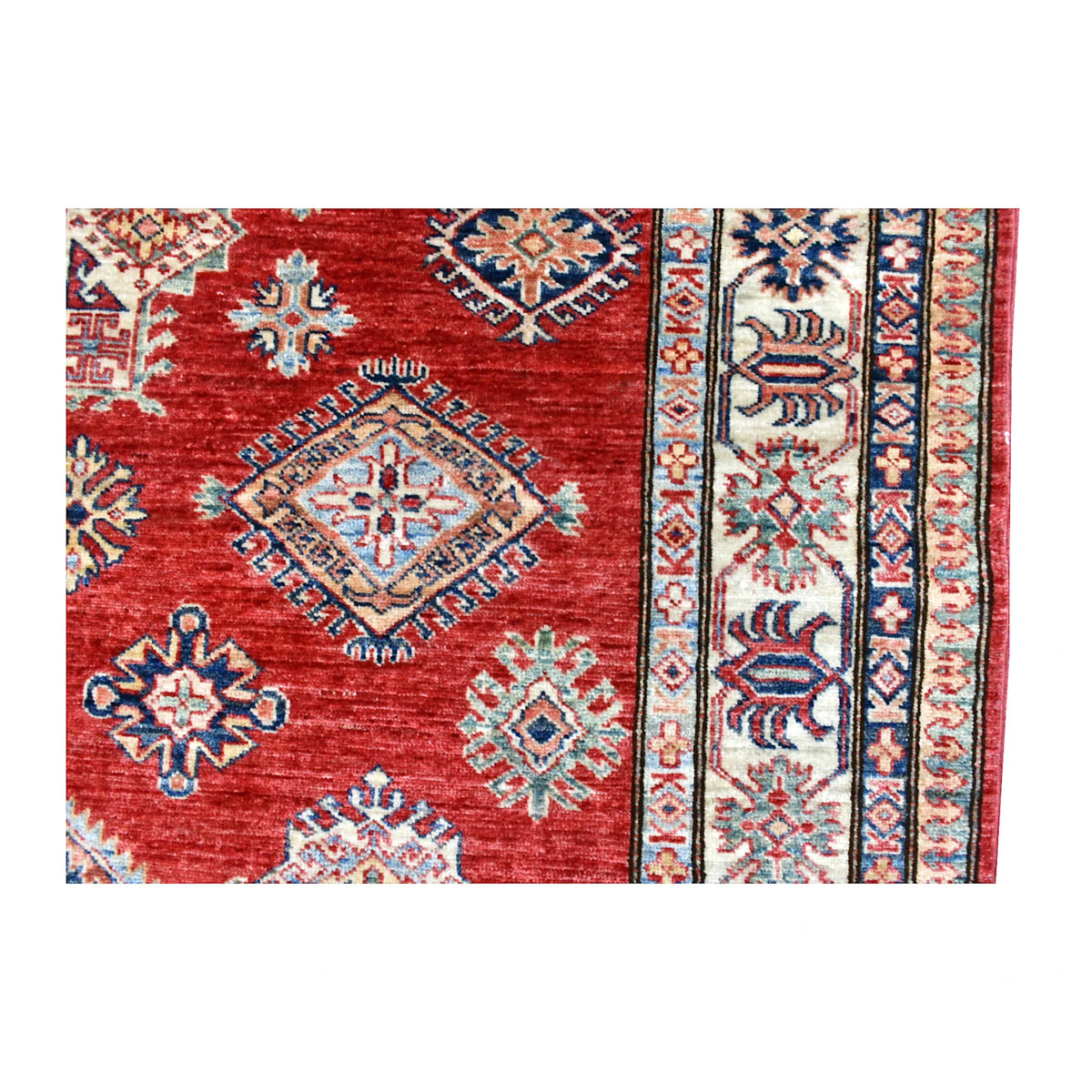 Field and side-border detail of Afghan Super Kazak rug showing multicoloured diamond medallions and layered geometric borders