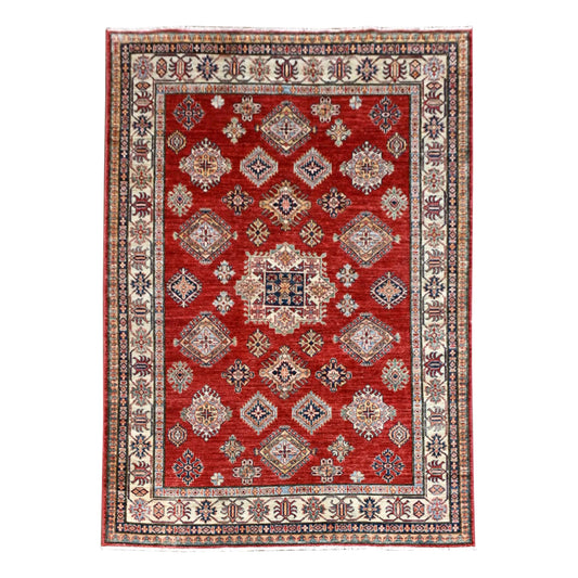 Full view of Afghan Super Kazak hand-knotted wool rug with a red field, diamond medallions and broad ivory border, 246 x 185 cm