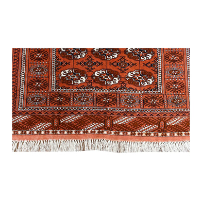 Fringe and end-border detail of Afghan Turkmen Tekke rug with narrow geometric bands and patterned end panel
