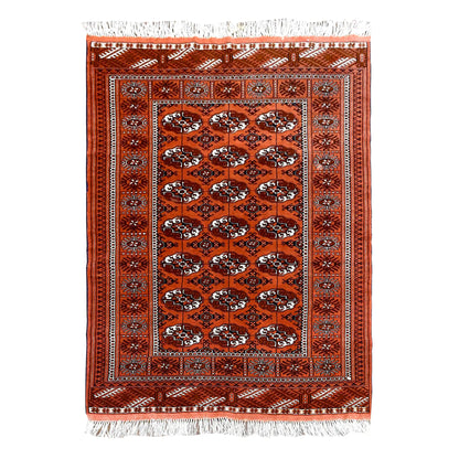 Full view of Afghan Turkmen Tekke hand-knotted wool rug with a rusty-orange field of repeated gul motifs, 167 x 125 cm