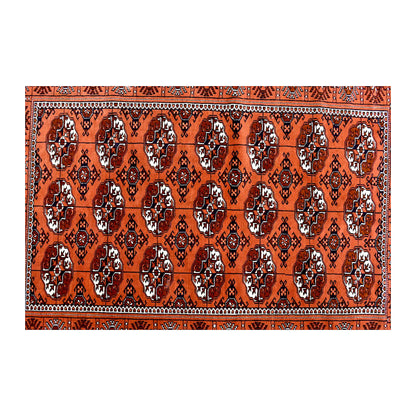 Field detail of repeated Tekke gul motifs in rusty orange, black and ivory