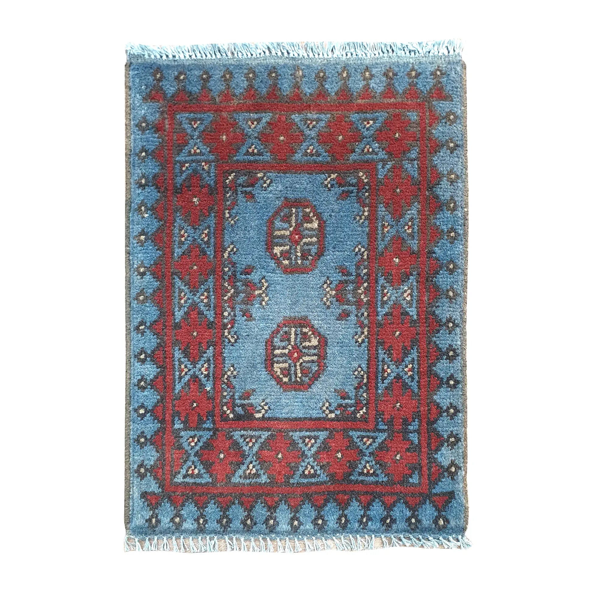 Afghan Turkoman blue wool rug 63 x 49 cm full view with twin octagonal gul medallions and red tribal border