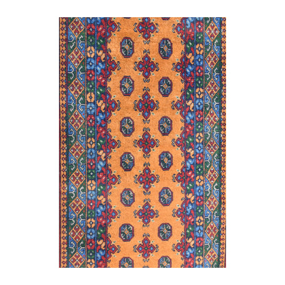 Field detail of Afghan Turkoman runner showing rows of dark oval medallions and small red motifs against golden ochre