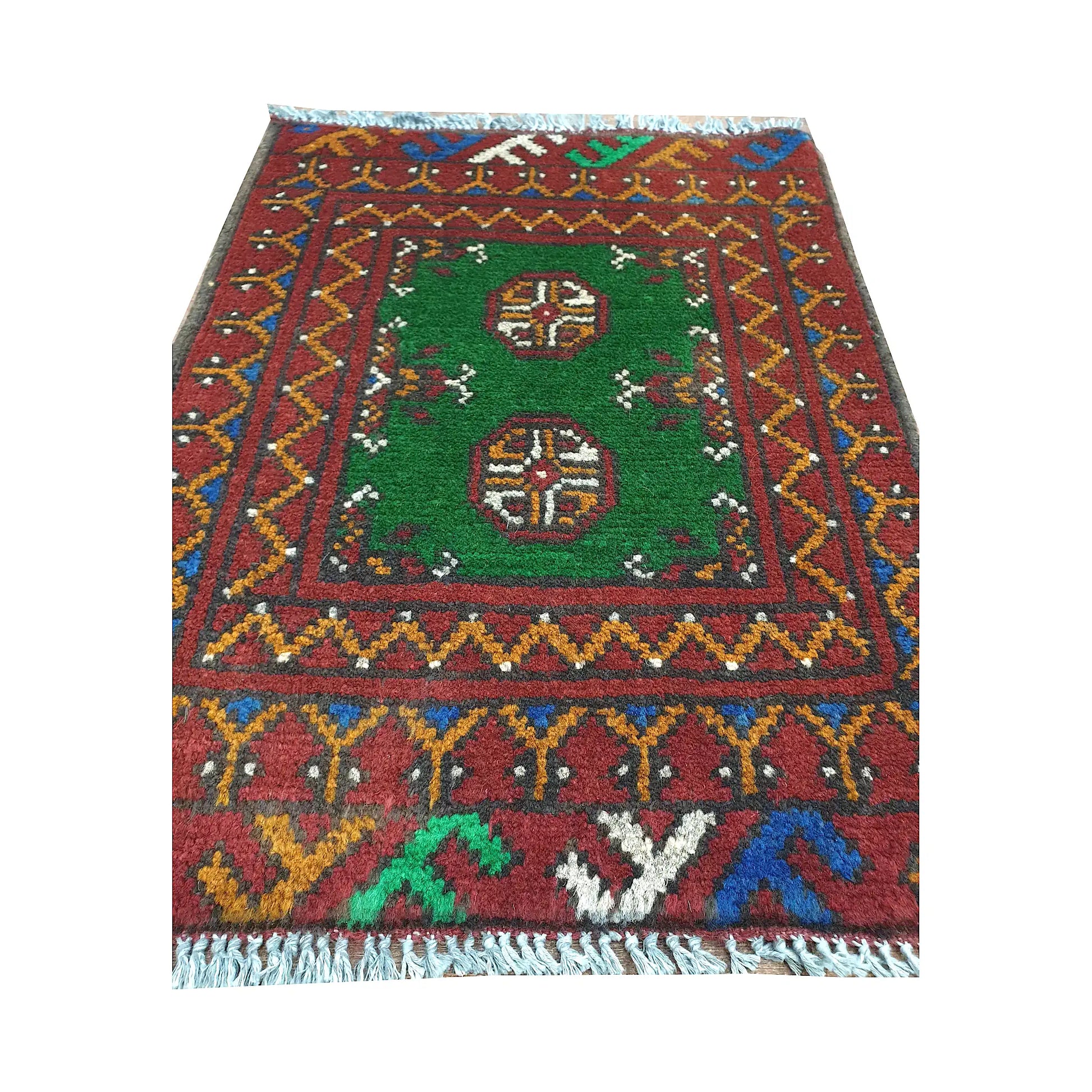 Afghan Turkoman green wool rug detail showing twin gul medallions, green field and multicolour border pattern