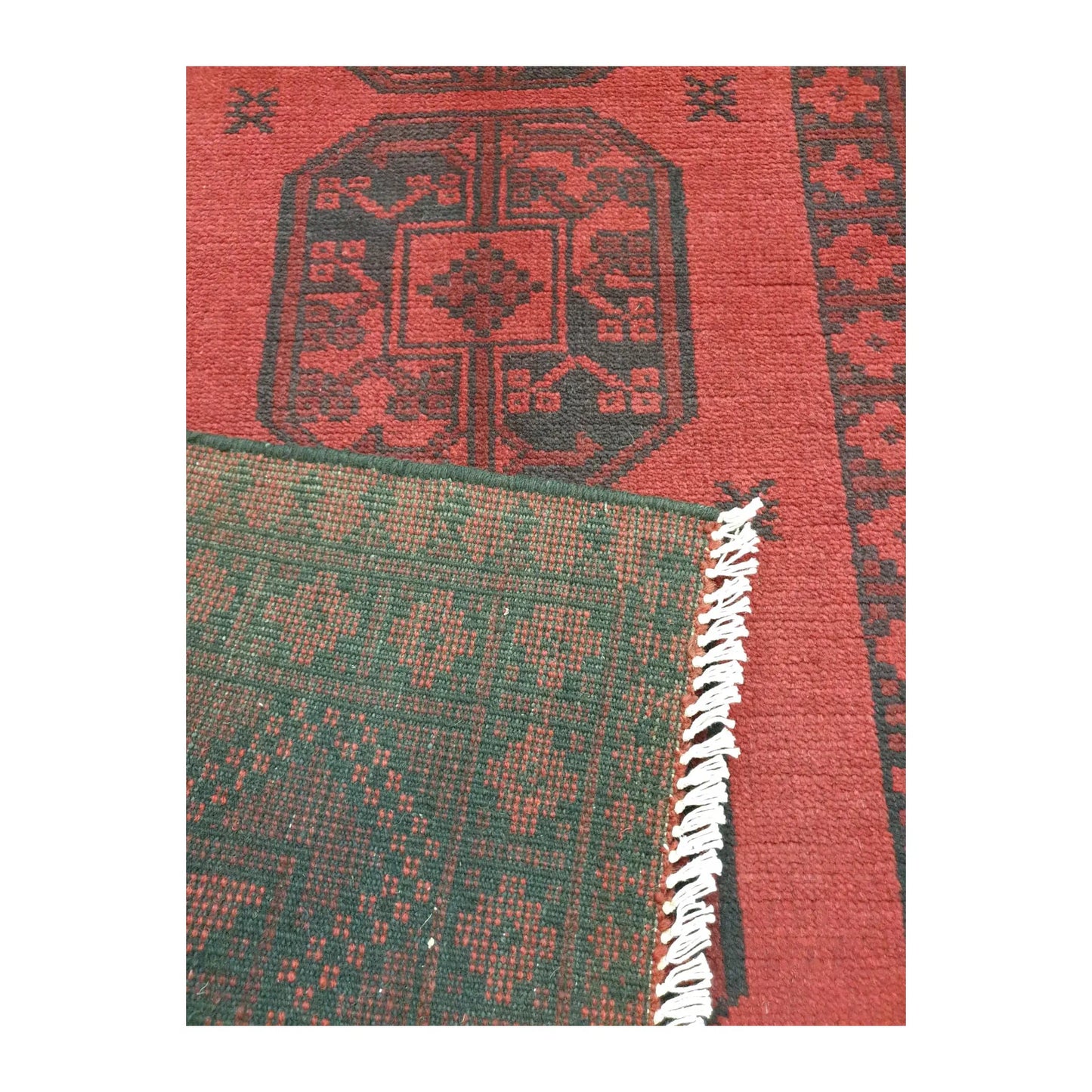 Reverse weave detail of Afghan Turkoman hand-knotted wool rug showing back construction and edge finish