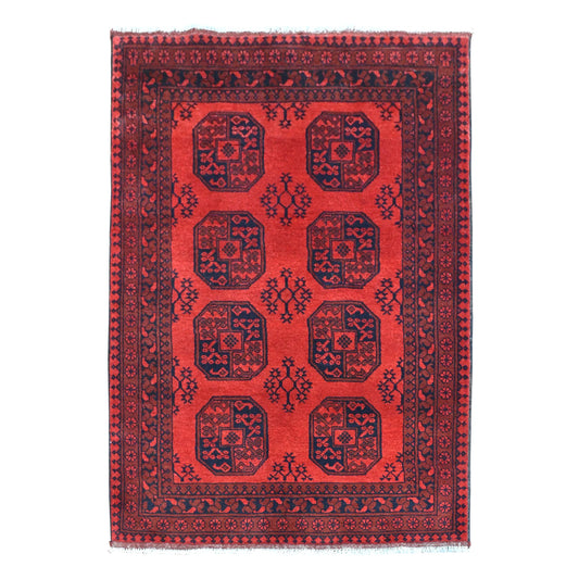 Full view of Afghan Turkoman rug with eight octagonal guls arranged in two columns on a deep red field, 187 x 132 cm
