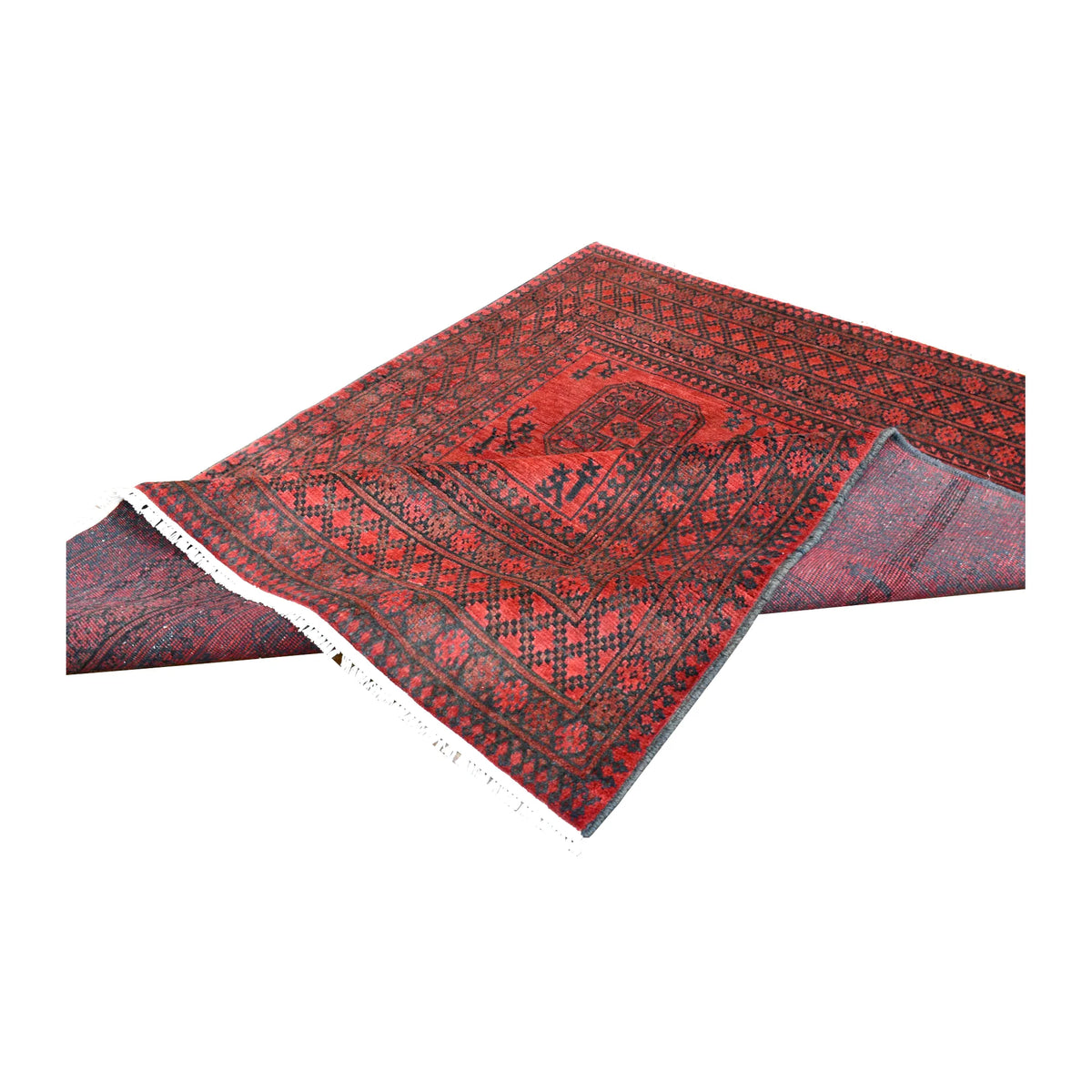 Folded view of Afghan Turkoman rug showing its red gul field, wide patterned borders and ivory fringe