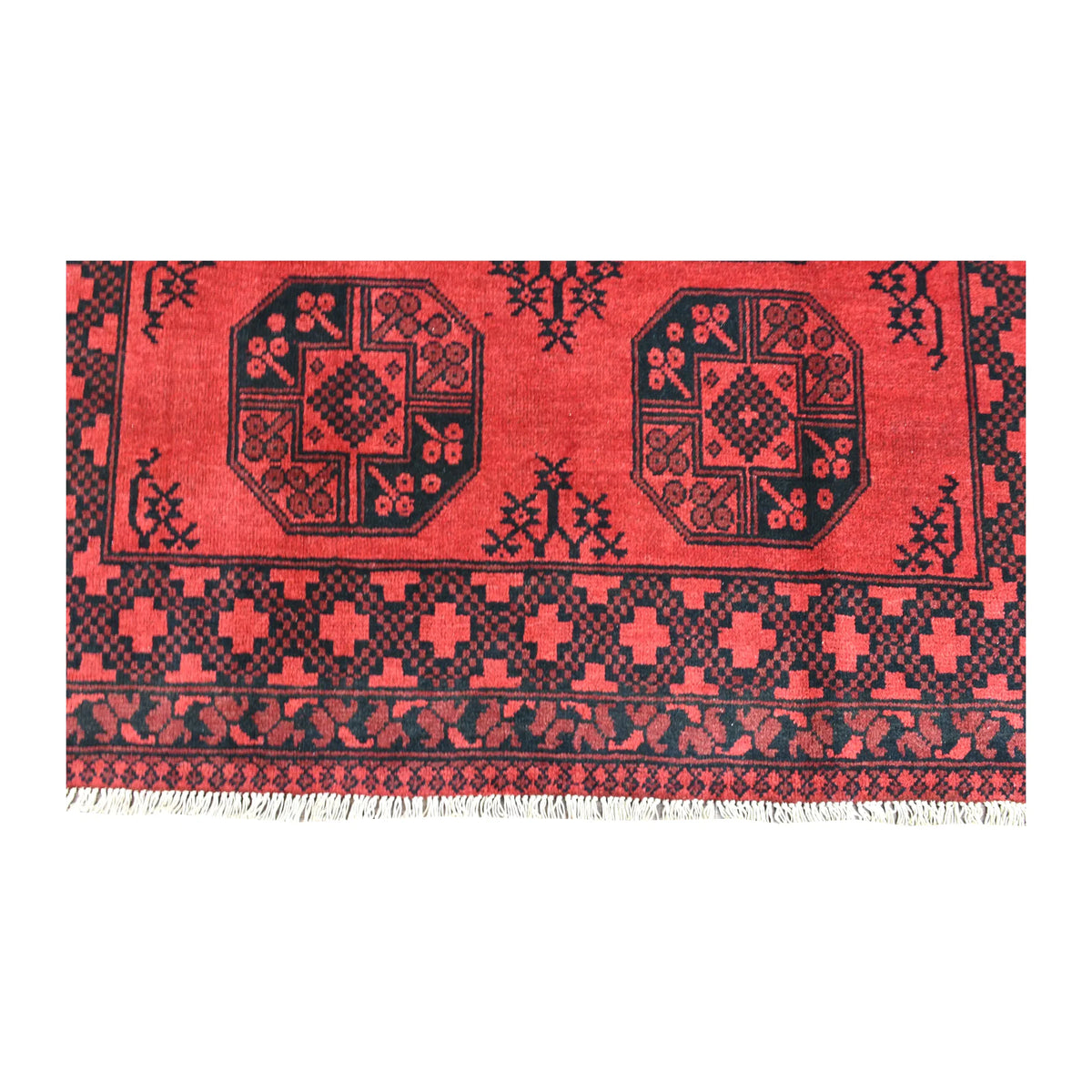 Fringe and end-border detail of Afghan Turkoman rug with paired octagonal guls, stylised plant fillers and cross-patterned border
