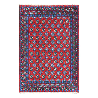 Full view of Afghan Turkoman hand-knotted wool rug with red field, rows of dark guls and layered blue borders, 235 x 167 cm