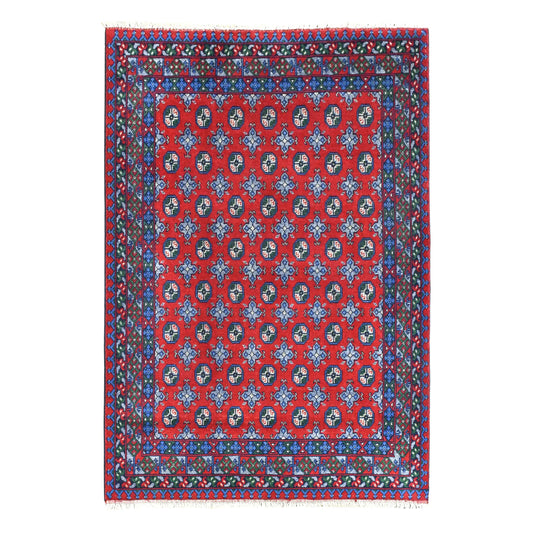 Full view of Afghan Turkoman hand-knotted wool rug with red field, rows of dark guls and layered blue borders, 235 x 167 cm