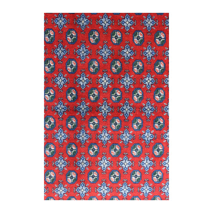 Field detail of Afghan Turkoman rug showing dark octagonal guls alternating with muted blue diamond motifs on red