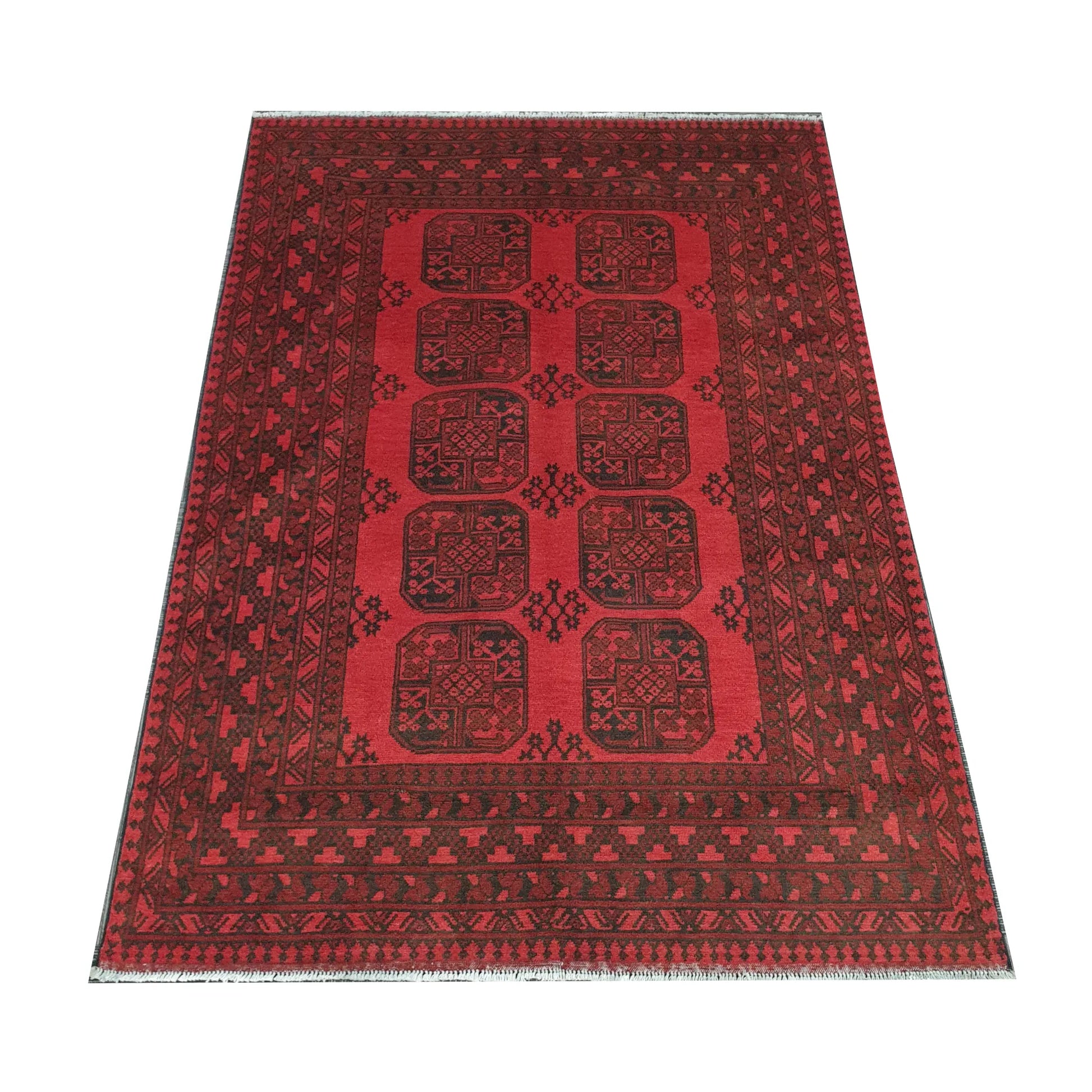 Angled view of Afghan Turkoman hand-knotted wool rug showing red field, border and fringe, 238 x 171 cm