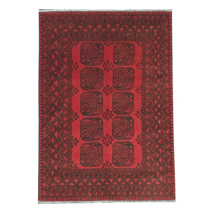 Full straightened view of Afghan Turkoman hand-knotted wool rug with red field and repeated gul-style medallions, 238 x 171 cm