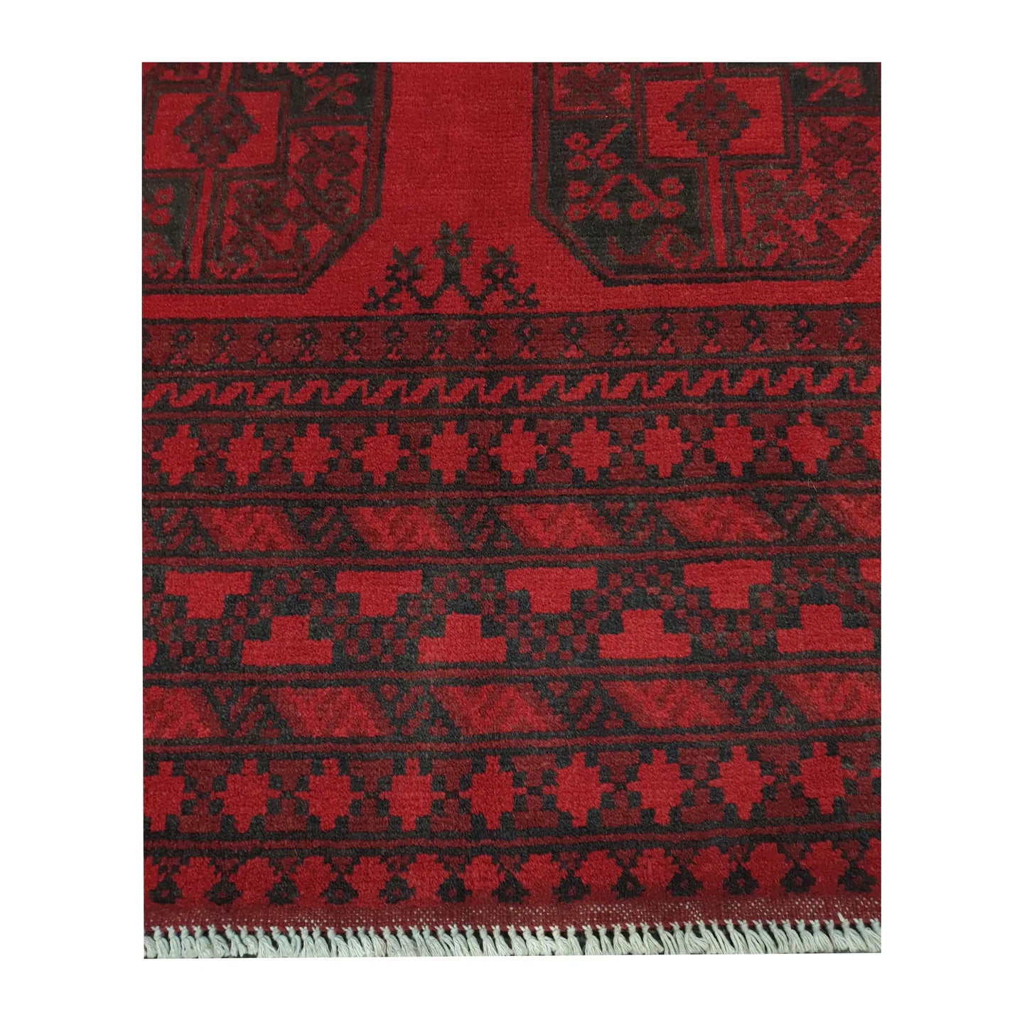 Border and fringe detail of Afghan Turkoman hand-knotted wool rug showing red pile and dark tribal pattern