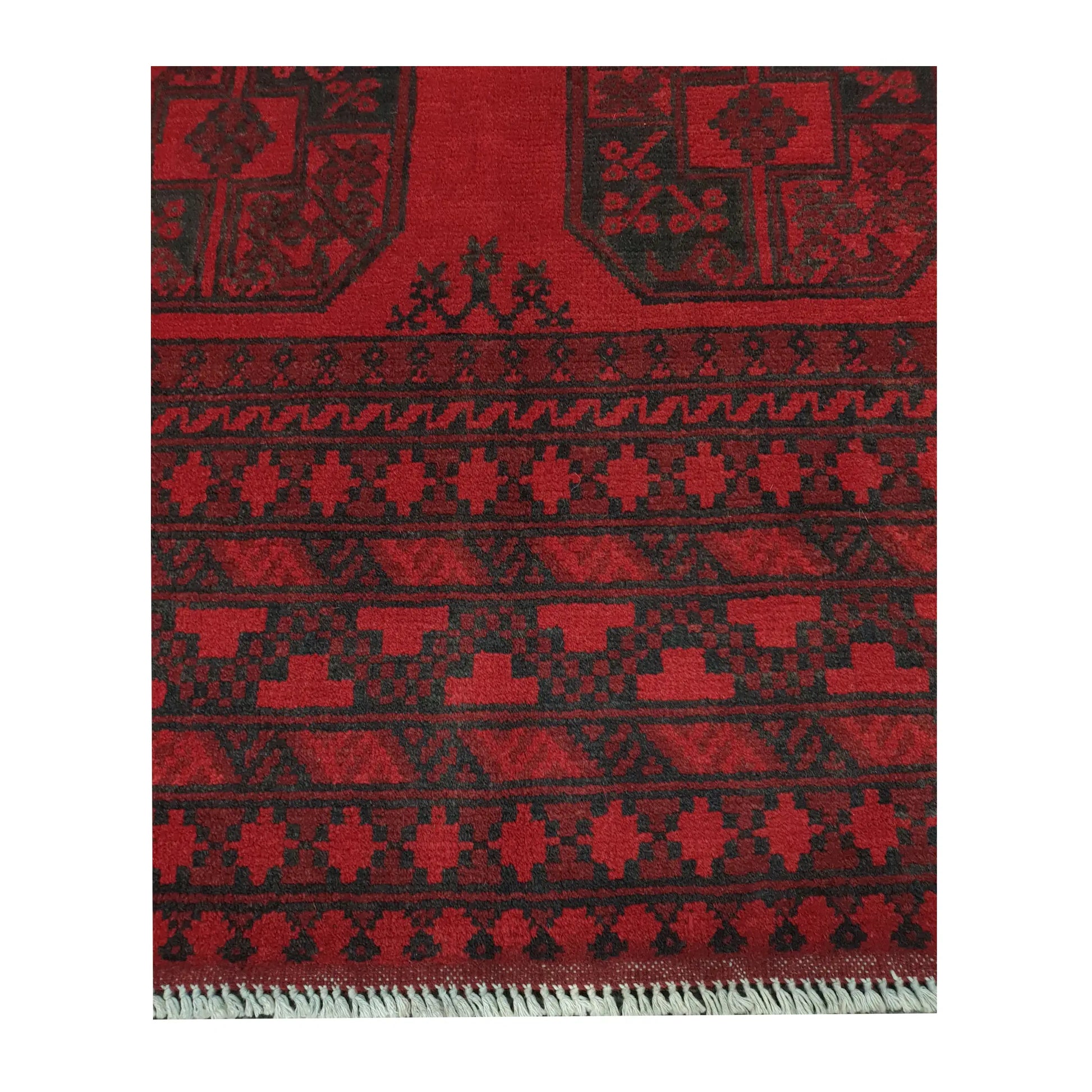 Border and fringe detail of Afghan Turkoman hand-knotted wool rug showing red pile and dark tribal pattern