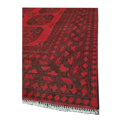 Corner and fringe detail of Afghan Turkoman hand-knotted wool rug with layered geometric border