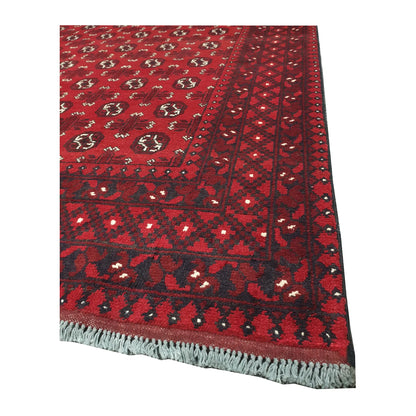 Corner and fringe detail of Afghan Turkoman hand-knotted wool rug with layered geometric border