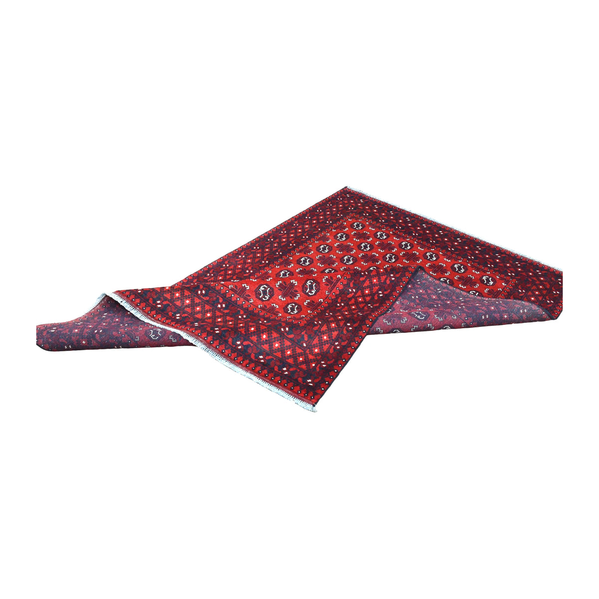 Folded view of Afghan Turkoman wool rug showing its red patterned front, geometric border and reverse